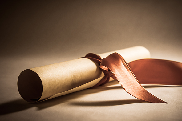 stock-photo-a-parchment-diploma-scroll-rolled-up-with-red-ribbon-laid-at-an-oblique-angle-processed-to-give-155241647