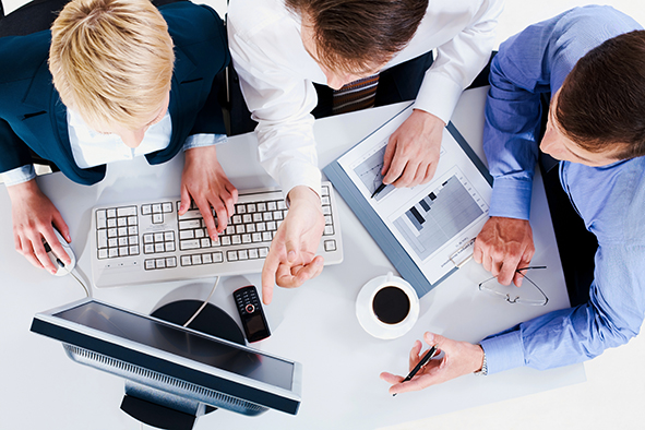 stock-photo-above-view-of-business-people-discussing-computer-work-54979021